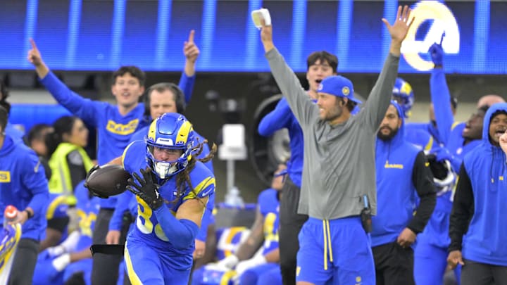 Jan 5, 2025; Inglewood, California, USA; Los Angeles Rams wide receiver Jordan Whittington (88) runs down the sideline as quarterback Matthew Stafford (9) raises his arms for a 50 yard gain in the second half against the Seattle Seahawks at SoFi Stadium. Mandatory Credit: Jayne Kamin-Oncea-Imagn Images