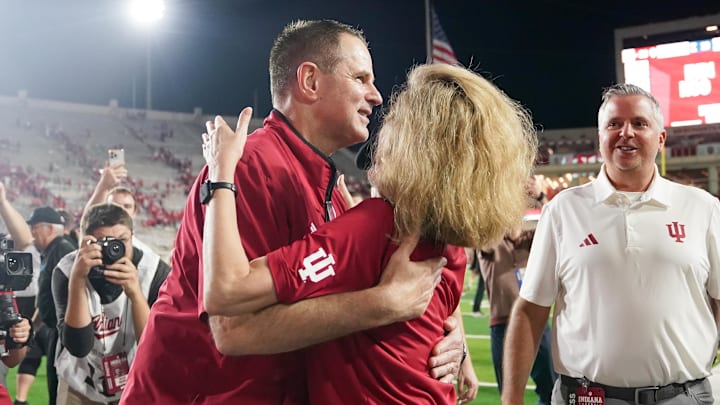 Sep 20, 2025; Bloomington, Indiana, USA; Indiana Hoosiers head coach Curt Cignetti celebrates with Indiana University President Pamela Whitten after defeating the Illinois Fighting Illini at Memorial Stadium. Mandatory Credit: Robert Goddin-Imagn Images