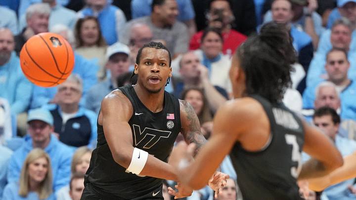 Feb 28, 2026; Chapel Hill, N.C.; Virginia Tech forward Amani Hansberry (13) passes the ball to guard Ben Hammond (3). Feb 28, 2026; Chapel Hill, N.C.; Virginia Tech forward Amani Hansberry (13) passes the ball to guard Ben Hammond (3).