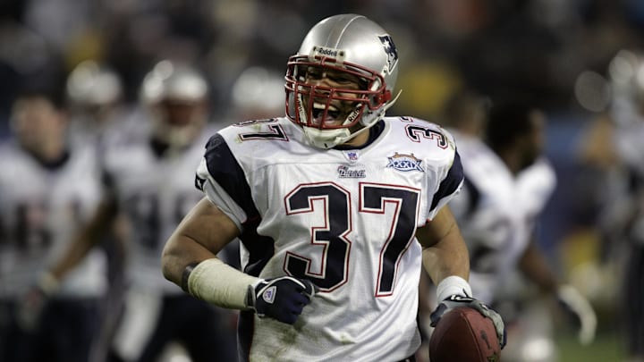 Feb 06, 2005; Jacksonville, FL, USA; New England safety Rodney Harrison (37) celebrates his late-game interception that sealed the Patriots 24-21 win over the Philadelphia Eagles in Super Bowl XXXIX at Alltel Stadium. Mandatory Credit: Photo by Dilip Vishwanat-Imagn Images