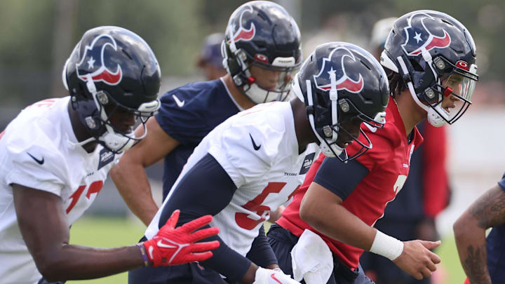 May 12, 2023; Houston, TX, USA; Houston Texans quarterback C. J. Stroud (7) stretches during rookie