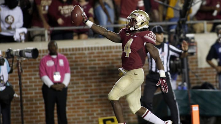 Oct 10, 2015; Tallahassee, FL, USA; FSU running back Dalvin Cook (4) celebrates his third touchdown of the game as Florida State beats Miami 29-24 at Doak Campbell Stadium. Mandatory Credit: Glenn Beil-Imagn Images