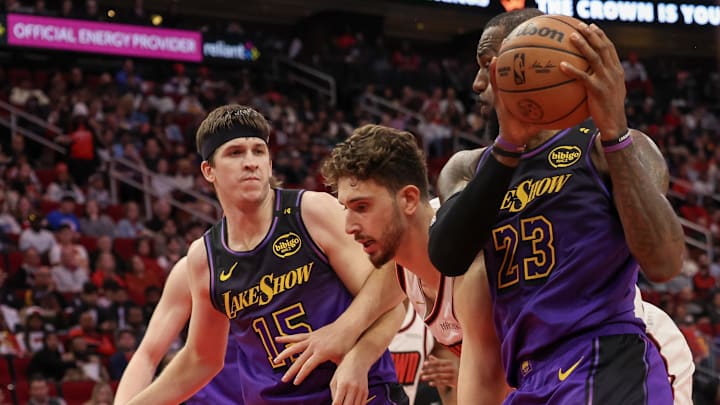 Los Angeles Lakers forward LeBron James (23) grabs a defensive rebound against Houston Rockets center Alperen Sengun (28)