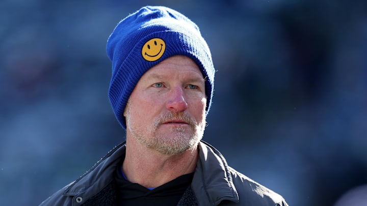 Dec 22, 2024; East Rutherford, New Jersey, USA; Los Angeles Rams general manager Les Snead watches his team warm up before a game against the New York Jets at MetLife Stadium. Mandatory Credit: Brad Penner-Imagn Images Dec 22, 2024; East Rutherford, New Jersey, USA; Los Angeles Rams general manager Les Snead watches his team warm up before a game against the New York Jets at MetLife Stadium. Mandatory Credit: Brad Penner-Imagn Images