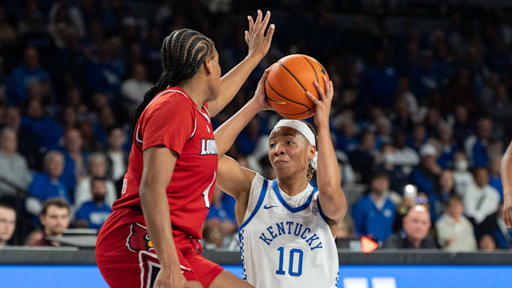 Kentucky Wildcats guard Dazia Lawrence (10) looks for an open pass around Louisville Cardinals forward Mackenly Randolph (4) during their game on Saturday, Nov. 16, 2024 at Memorial Coliseum in Lexington, Ky.