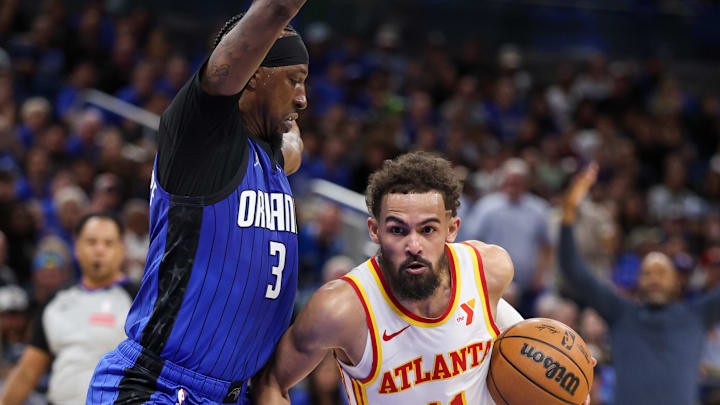 Apr 15, 2025; Orlando, Florida, USA; Atlanta Hawks guard Trae Young (11) controls the ball against the Orlando Magic in the second quarter at Kia Center. Mandatory Credit: Nathan Ray Seebeck-Imagn Images