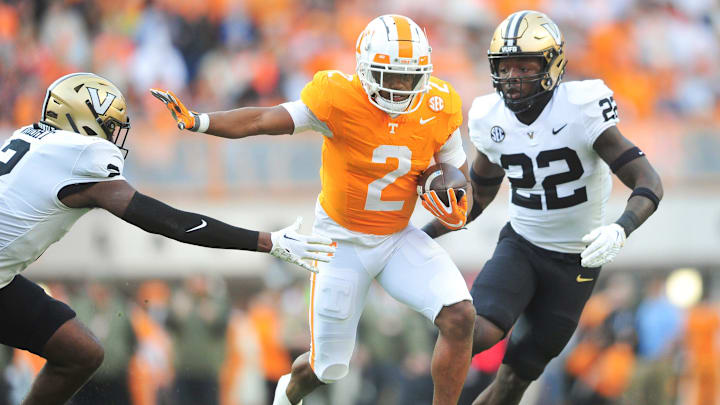 Tennessee running back Jabari Small (2) runs the ball while defended by Vanderbilt safety De  