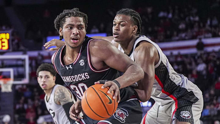 Jan 28, 2025; Athens, Georgia, USA; South Carolina Gamecocks forward Collin Murray-Boyles (30) dribbles against Georgia Bulldogs forward RJ Godfrey (10) at Stegeman Coliseum. Mandatory Credit: Dale Zanine-Imagn Images