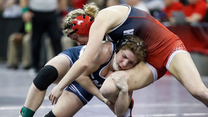 Lena High School's Taylor Whiting (in blue)  competes in the girls 114-pound championship match during the WIAA state individual wrestling tournament on Saturday, March 1, 2025, at the Kohl Center in Madison, Wis. Tork Mason/USA TODAY NETWORK-Wisconsin