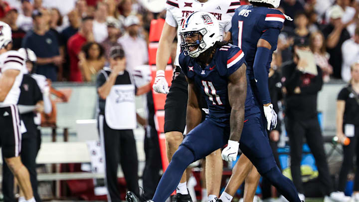 Oct 5, 2024; Tucson, Arizona, USA; Arizona Wildcats defensive lineman Chase Kennedy (11) celebrates tackle against Texas Tech Red Raiders during first quarter at Arizona Stadium. Mandatory Credit: Aryanna Frank-Imagn Images Oct 5, 2024; Tucson, Arizona, USA; Arizona Wildcats defensive lineman Chase Kennedy (11) celebrates tackle against Texas Tech Red Raiders during first quarter at Arizona Stadium. Mandatory Credit: Aryanna Frank-Imagn Images