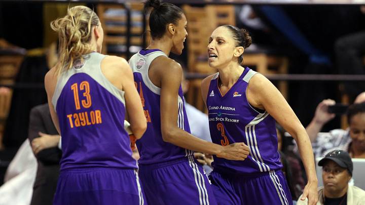 Sep 12, 2014; Chicago, IL, USA; Phoenix Mercury guard Diana Taurasi (3) celebrates with teammates Penny Taylor (13) and DeWanna Bonner (24) after making a basket while being fouled by the Chicago Sky in the fourth quarter in game three of the 2014 WNBA Finals at UIC Pavilion. Mandatory Credit: Jerry Lai-Imagn Images