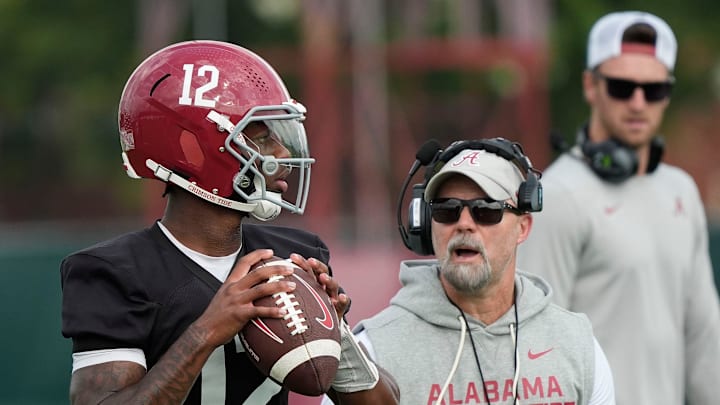 July 30, 2025; Tuscaloosa, AL, USA; Quarterback Keelon Russell drops back under the watch of offensive coordinator Ryan Grubb during the first practice session of the preseason for the Alabama Crimson Tide. 