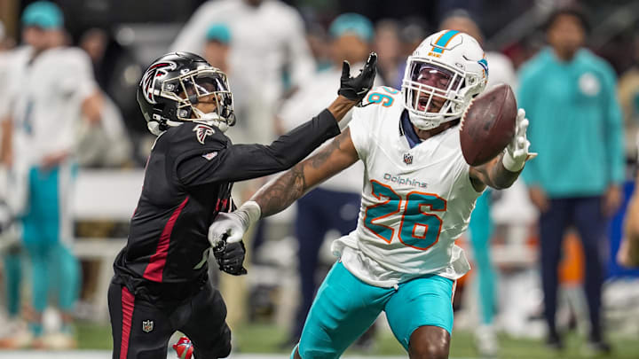 Miami Dolphins cornerback Rasul Douglas (26) is called for pass interference while defending Atlanta Falcons wide receiver Darnell Mooney (1) during the second half at Mercedes-Benz Stadium. 