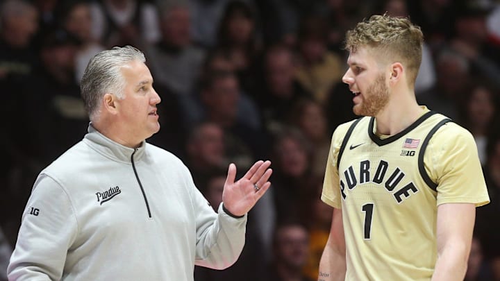 Purdue Boilermakers head coach Matt Painter talks to forward Caleb Furst (1) Purdue Boilermakers head coach Matt Painter talks to forward Caleb Furst (1)