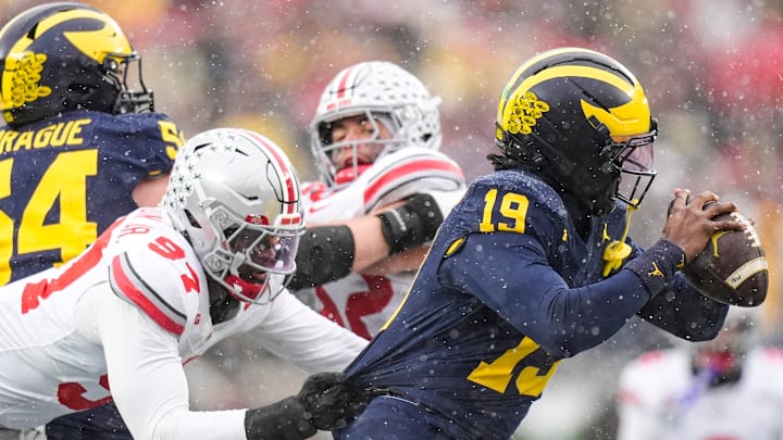 Ohio State defensive end Kenyatta Jackson Jr. (97) sacks Michigan quarterback Bryce Underwood (19) during the second half at Michigan Stadium in Ann Arbor on Saturday, Nov. 29, 2025.