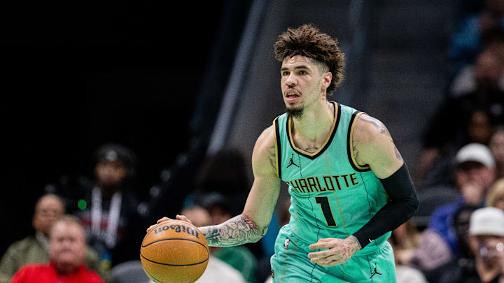 Jan 25, 2025; Charlotte, North Carolina, USA; Charlotte Hornets guard LaMelo Ball (1) brings the ball up court against the New Orleans Pelicans during the first quarter at Spectrum Center. Mandatory Credit: Scott Kinser-Imagn Images