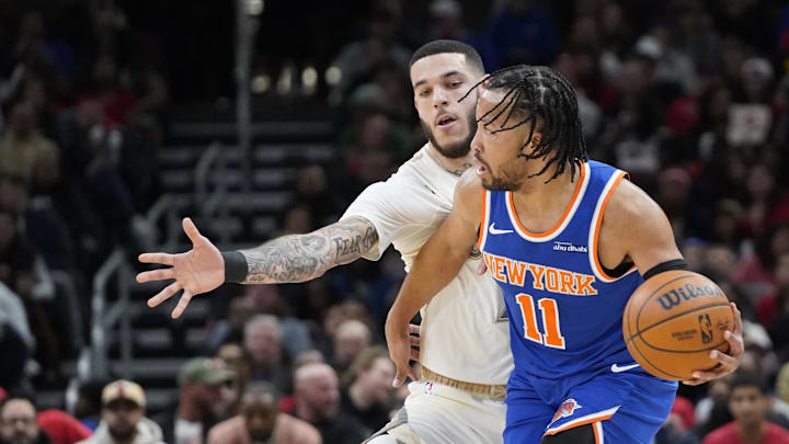 Jan 4, 2025; Chicago, Illinois, USA; New York Knicks guard Jalen Brunson (11) controls the ball against Chicago Bulls guard Lonzo Ball (2) during the first quarter at United Center. Mandatory Credit: David Banks-Imagn Images