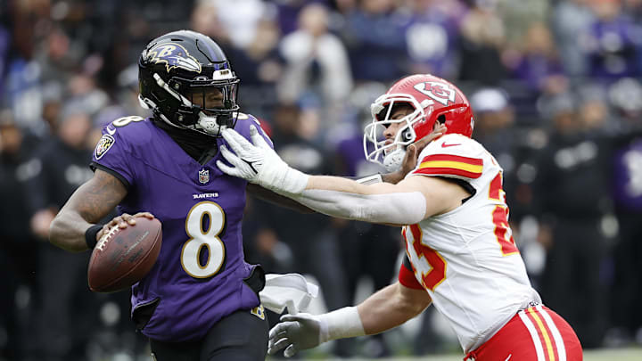 Jan 28, 2024; Baltimore, Maryland, USA; Baltimore Ravens quarterback Lamar Jackson (8) prepares to throw the ball as Kansas City Chiefs linebacker Drue Tranquill (23) defends during the first half in the AFC Championship football game at M&T Bank Stadium. Mandatory Credit: Geoff Burke-USA TODAY Sports Jan 28, 2024; Baltimore, Maryland, USA; Baltimore Ravens quarterback Lamar Jackson (8) prepares to throw the ball as Kansas City Chiefs linebacker Drue Tranquill (23) defends during the first half in the AFC Championship football game at M&T Bank Stadium. Mandatory Credit: Geoff Burke-USA TODAY Sports