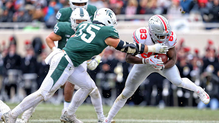 Nov 10, 2018; East Lansing, MI, USA; Ohio State Buckeyes wide receiver Terry McLaurin (83) makes a catch in front of Michigan State Spartans linebacker Joe Bachie (35) during the second half of a game at Spartan Stadium. Mandatory Credit: Mike Carter-Imagn Images