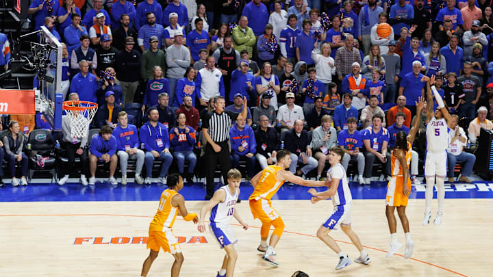 Jan 7, 2025; Gainesville, Florida, USA; Florida Gators guard Will Richard (5) shoots a three point basket over Tennessee Volunteers guard Chaz Lanier (2) during the second half at Exactech Arena at the Stephen C. O'Connell Center. Mandatory Credit: Matt Pendleton-Imagn Images