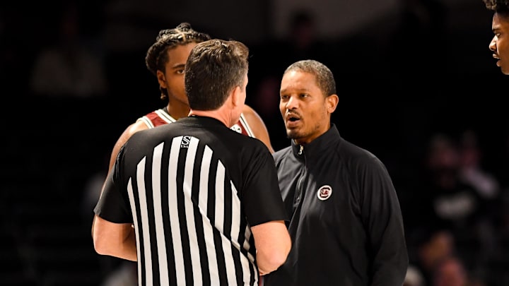 Jan 15, 2025; Nashville, Tennessee, USA;  South Carolina Gamecocks head coach Lamont Paris talks with the referee against the Vanderbilt Commodores during the first half at Memorial Gymnasium. Mandatory Credit: Steve Roberts-Imagn Images