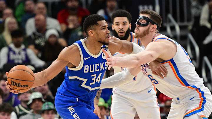 Mar 16, 2025; Milwaukee, Wisconsin, USA; Milwaukee Bucks forward Giannis Antetokounmpo (34) drives for the basket against Oklahoma City Thunder center Isaiah Hartenstein (55) in the second quarter at Fiserv Forum. Mandatory Credit: Benny Sieu-Imagn Images Mar 16, 2025; Milwaukee, Wisconsin, USA; Milwaukee Bucks forward Giannis Antetokounmpo (34) drives for the basket against Oklahoma City Thunder center Isaiah Hartenstein (55) in the second quarter at Fiserv Forum. Mandatory Credit: Benny Sieu-Imagn Images