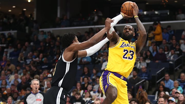 Mar 27, 2024; Memphis, Tennessee, USA; Los Angeles Lakers forward LeBron James shoots as Memphis Grizzlies forward GG Jackson defends him. Mar 27, 2024; Memphis, Tennessee, USA; Los Angeles Lakers forward LeBron James shoots as Memphis Grizzlies forward GG Jackson defends him.