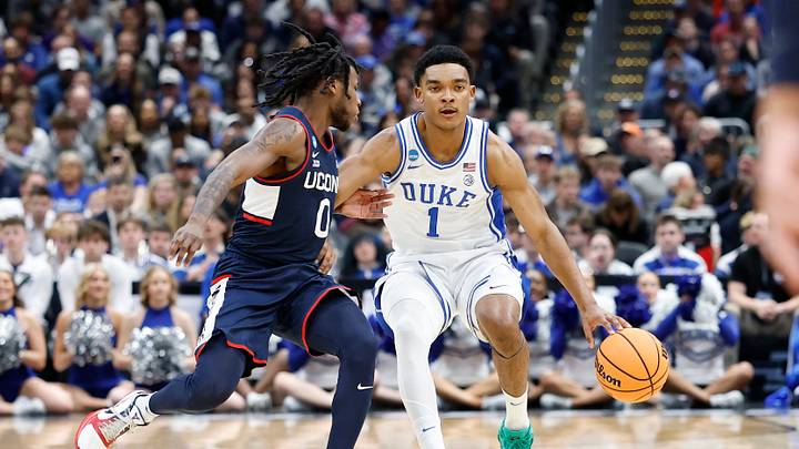 Mar 29, 2026; Washington, DC, USA; Duke Blue Devils guard Caleb Foster (1) dribbles the ball as UConn Huskies guard Malachi Smith (0) defends in the first half during an Elite Eight game of the East Regional of the men's 2026 NCAA Tournament at Capital One Arena. Mandatory Credit: Amber Searls-Imagn Images Mar 29, 2026; Washington, DC, USA; Duke Blue Devils guard Caleb Foster (1) dribbles the ball as UConn Huskies guard Malachi Smith (0) defends in the first half during an Elite Eight game of the East Regional of the men's 2026 NCAA Tournament at Capital One Arena. Mandatory Credit: Amber Searls-Imagn Images