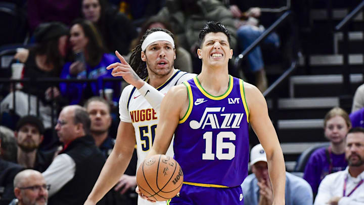 Simone Fontecchio grimaces in a game against the Denver Nuggets.