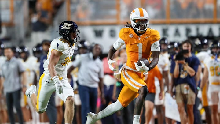 Sep 14, 2024; Knoxville, Tennessee, USA; Tennessee Volunteers wide receiver Dont'e Thornton Jr. (1) catches a pass against Kent State Golden Flashes safety Nick Cuva (36) at Neyland Stadium. Mandatory Credit: Randy Sartin-Imagn Images