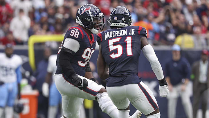 Dec 31, 2023; Houston, Texas, USA; Houston Texans defensive end Will Anderson Jr. (51) and defensive tackle Sheldon Rankins (98) react after a play during the game against the Tennessee Titans at NRG Stadium. Mandatory Credit: Troy Taormina-Imagn Images