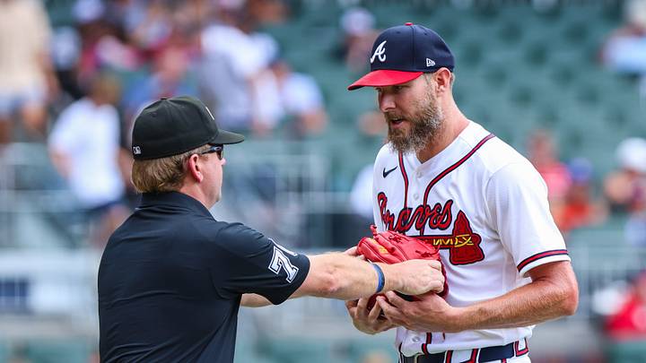 Jul 23, 2026; Cumberland, Georgia, USA; Atlanta Braves pitcher Chris Sale (51) gets his gloved checked by umpire Mike Muchlinski (76) during the game against the San Diego Padres during the first inning at Truist Park. Mandatory Credit: Jordan Godfree-Imagn Images
