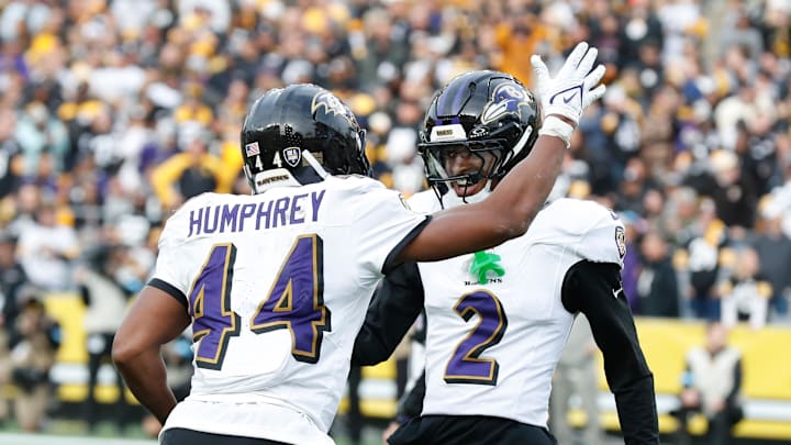 Nov 17, 2024; Pittsburgh, Pennsylvania, USA;  Baltimore Ravens cornerback Marlon Humphrey (44) celebrates with cornerback Nate Wiggins (2) after Humphrey intercepted a pass in the end-zone intended for Pittsburgh Steelers tight end Darnell Washington (not pictured) during the fourth quarter at Acrisure Stadium. Mandatory Credit: Charles LeClaire-Imagn Images