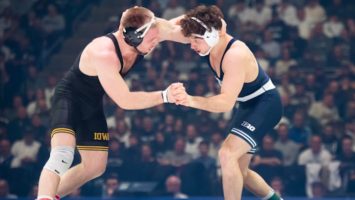 Penn State’s Levi Haines, right, wrestles Iowa's Patrick Kennedy in a Big Ten dual match at the Bryce Jordan Center.