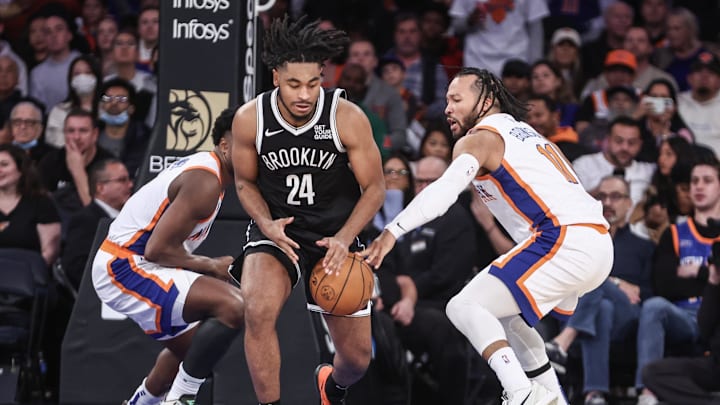 Nov 17, 2024; New York, New York, USA;  New York Knicks guard Jalen Brunson (11) knocks the ball away from Brooklyn Nets guard Cam Thomas (24) in the third quarter at Madison Square Garden. Mandatory Credit: Wendell Cruz-Imagn Images