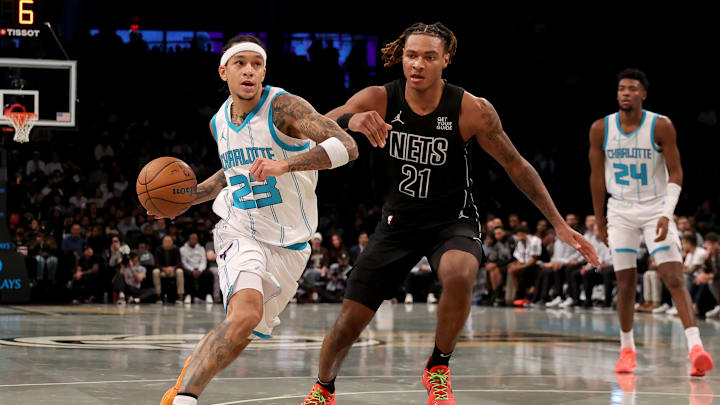 Nov 19, 2024; Brooklyn, New York, USA; Charlotte Hornets guard Tre Mann (23) drives to the basket against Brooklyn Nets forward Noah Clowney (21) during the second quarter at Barclays Center. Mandatory Credit: Brad Penner-Imagn Images Nov 19, 2024; Brooklyn, New York, USA; Charlotte Hornets guard Tre Mann (23) drives to the basket against Brooklyn Nets forward Noah Clowney (21) during the second quarter at Barclays Center. Mandatory Credit: Brad Penner-Imagn Images