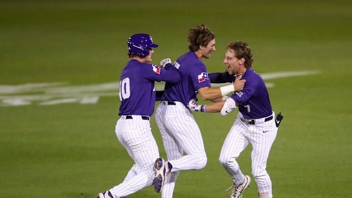 TCU infielder Cole Cramer celebrates with his teammates after the walk-off hit that drove in the winning run on Friday night. TCU infielder Cole Cramer celebrates with his teammates after the walk-off hit that drove in the winning run on Friday night.