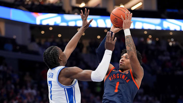 Mar 14, 2026; Charlotte, NC, USA; Virginia Cavaliers guard Malik Thomas (1) shoots over Duke Blue Devils guard Dame Sarr (7) during the men's ACC Conference Tournament Championship at Spectrum Center. Mandatory Credit: Jim Dedmon-Imagn Images