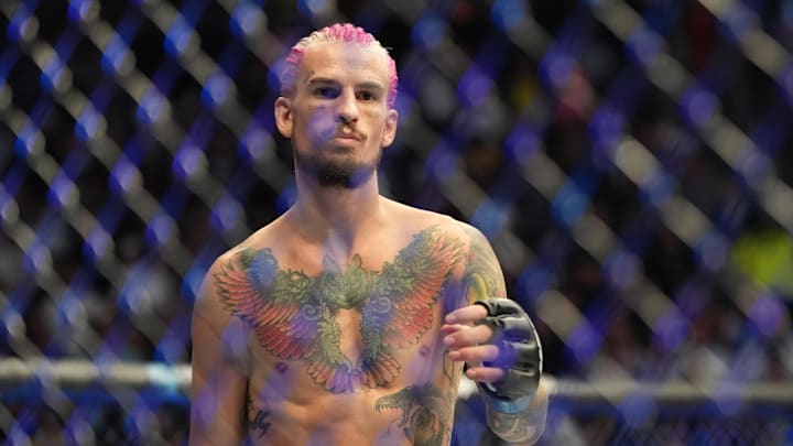 Jul 2, 2022; Las Vegas, Nevada, USA; Sean O'Malley (blue gloves) reacts before a bout against Pedro Munhoz (red gloves) during UFC 276 at T-Mobile Arena. Mandatory Credit: Stephen R. Sylvanie-Imagn Images