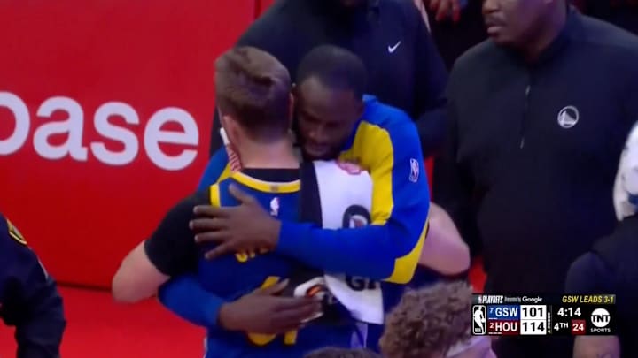 Draymond Green hugs Pat Spencer after he's ejected from Game 5 between the Golden State Warriors and Houston Rockets