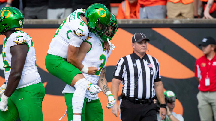 Oregon quarterback Dillon Gabriel celebrates a touchdown with Oregon tight end Terrance Ferguson as the Oregon State Beavers host the Oregon Ducks Saturday, Sept. 14, 2024 at Reser Stadium in Corvallis, Ore.