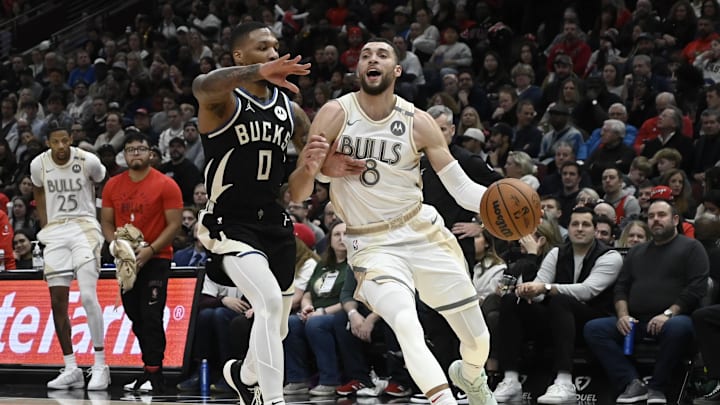Dec 28, 2024; Chicago, Illinois, USA; Chicago Bulls guard Zach LaVine (8) dribbles against Milwaukee Bucks guard Damian Lillard (0) during the first half at the United Center. Mandatory Credit: Matt Marton-Imagn Images Dec 28, 2024; Chicago, Illinois, USA; Chicago Bulls guard Zach LaVine (8) dribbles against Milwaukee Bucks guard Damian Lillard (0) during the first half at the United Center. Mandatory Credit: Matt Marton-Imagn Images