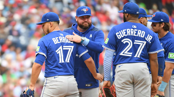 Jun 15, 2025; Philadelphia, Pennsylvania, USA; Toronto Blue Jays pitcher José Berríos (17) is removed from the game by manager John Schneider (14) during the fifth inning against the Philadelphia Phillies at Citizens Bank Park.