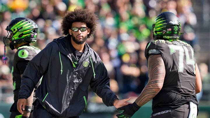 Oregon quarterback Dante Moore, left, greets Oregon offensive lineman Dave Iuli as the Oregon Ducks host the UCLA Bruins on Oct. 10, 2026, at Autzen Stadium in Eugene, Oregon.