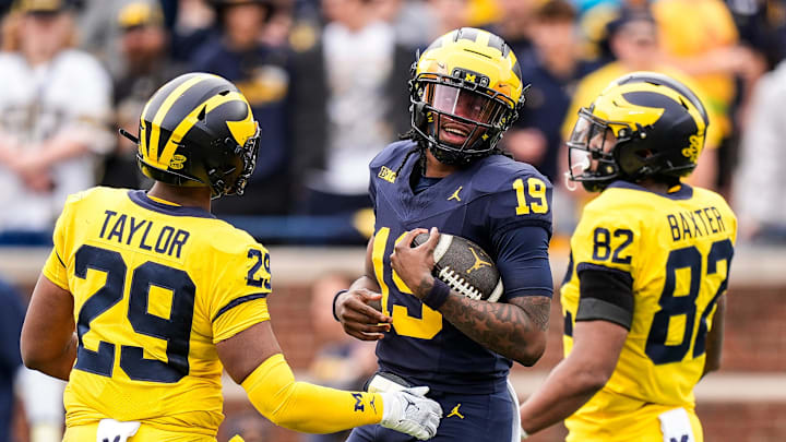 Team Blue Michigan quarterback Bryce Underwood (19) tries to run after recovering his fumble during the second half of the spring game at Michigan Stadium in Ann Arbor on Saturday, April 19, 2025.