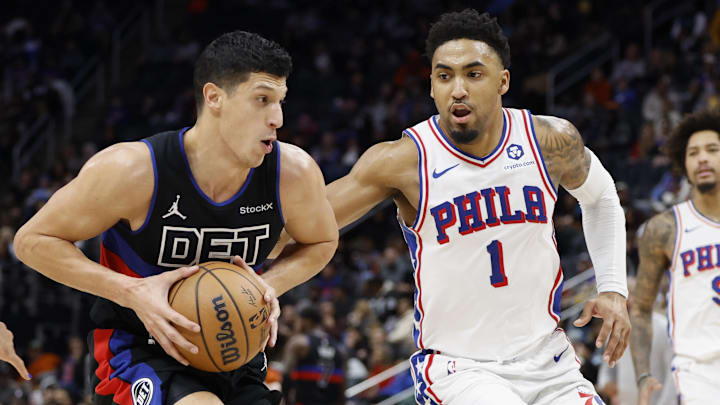 Nov 30, 2024; Detroit, Michigan, USA;  Detroit Pistons forward Simone Fontecchio (19) dribbles defended by Philadelphia 76ers forward KJ Martin (1) in the second half at Little Caesars Arena. Mandatory Credit: Rick Osentoski-Imagn Images