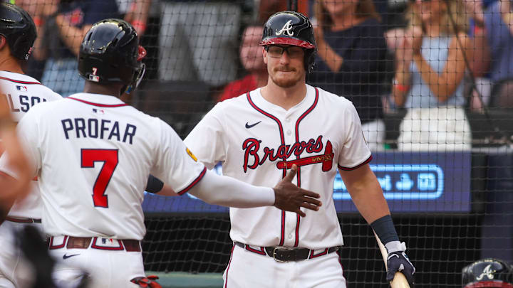 Atlanta, Georgia, USA; Atlanta Braves left fielder Jurickson Profar (7) celebrates after scoring with catcher Sean Murphy (12) against the San Francisco Giants in the first inning at Truist Park.