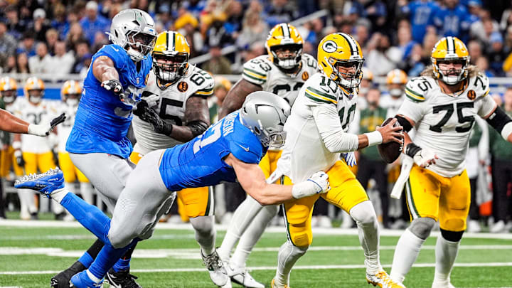 Detroit Lions defensive end Aidan Hutchinson (97) tackles Green Bay Packers quarterback Jordan Love (10) during the first half at Ford Field in Detroit on Thursday, Nov. 27, 2025.