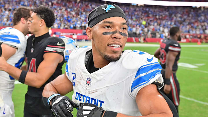 Detroit Lions wide receiver Amon-Ra St. Brown (14) looks on after beating the Arizona Cardinals at State Farm Stadium Detroit Lions wide receiver Amon-Ra St. Brown (14) looks on after beating the Arizona Cardinals at State Farm Stadium