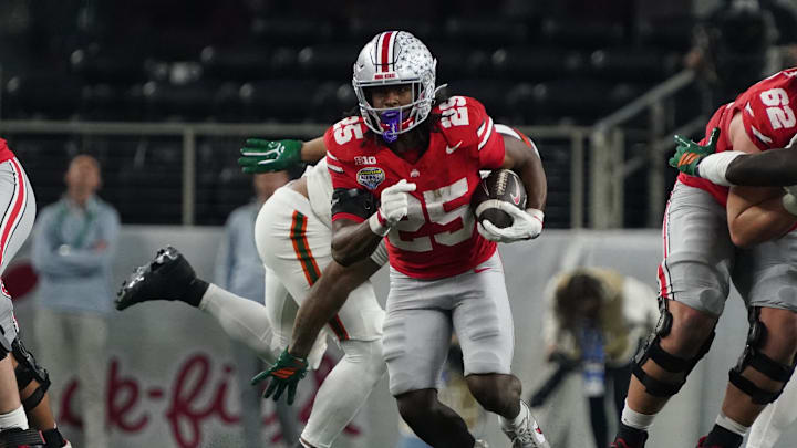 Dec 31, 2025; Arlington, TX, USA; Ohio State Buckeyes running back Bo Jackson (25) carries the ball against the Miami Hurricanes during the second half of 2025 Cotton Bowl and quarterfinal game of the College Football Playoff at AT&T Stadium. Mandatory Credit: Raymond Carlin III-Imagn Images Dec 31, 2025; Arlington, TX, USA; Ohio State Buckeyes running back Bo Jackson (25) carries the ball against the Miami Hurricanes during the second half of 2025 Cotton Bowl and quarterfinal game of the College Football Playoff at AT&T Stadium. Mandatory Credit: Raymond Carlin III-Imagn Images